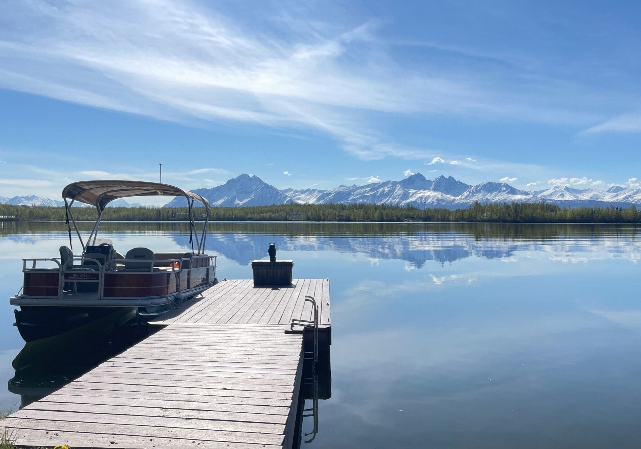 View of Wasilla Lake with Pioneer Peak rising in the background on a clear day.